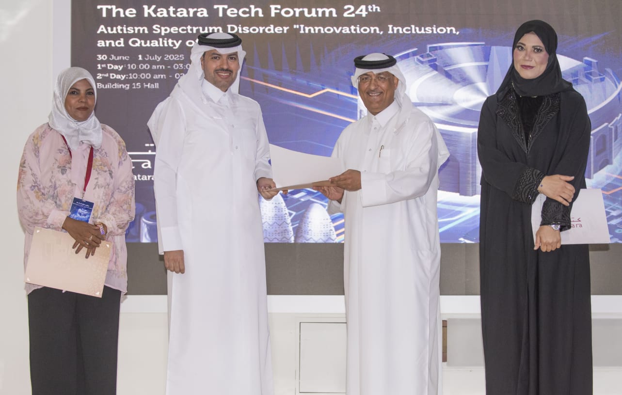 A certificate presentation in front of the Katara Tech 24 banner